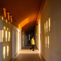 A corridor in the Bodhgaya hotel, where the architecture plays with light and shadow. The carefully placed openings create a rhythmic pattern, turning a simple passage into a meditative journey.