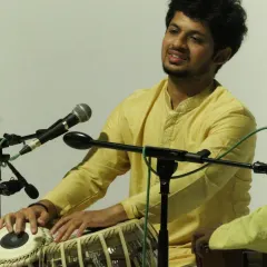 A moment of connection with the audience during a solo piece. The energy exchanged during a live concert is a vital part of the performance.