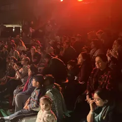 An audience of all ages watches a performance of 'Be Yourself' with rapt attention. Our goal is to curate shows that are engaging and meaningful for every member of the family, from the youngest child to the oldest grandparent.