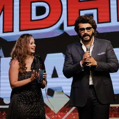 Sharing a moment on stage with Arjun Kapoor. I am experienced in managing the stage with celebrity guests, ensuring a smooth and engaging segment for everyone.