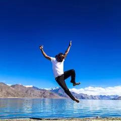 A jump of pure joy and freedom against the stunning blue sky and mountains of Ladakh. Yoga brings a sense of lightness and liberation to the soul.