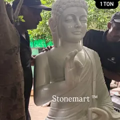 A close-up view of the serene face and detailed carving on our 5-foot white marble Buddha. The craftsmanship of our murtikars is evident in the peaceful expression, making this large stone Buddha statue a source of tranquility.