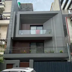 The finished home in Delhi, photographed on-site. The real-world result faithfully captures the architectural intent, proportions, and material palette of the initial 3D render.