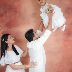 The pure joy on a child's face when being lifted by her father. These are the candid, energetic moments I love to capture during a family session, showing the playful side of your bond.