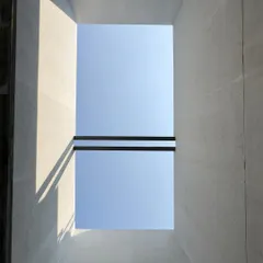 Forming with light. A simple opening to the sky in a building under construction becomes a device for drawing, casting sharp shadows that define the raw concrete space. This is architecture in its most elemental form.