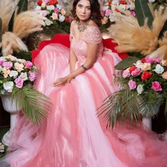 Make your fairytale moment happen with this stunning pink princess ball gown. Its voluminous layered skirt and delicate off-shoulder bodice are ideal for a grand reception or a pre-wedding shoot with a regal theme.