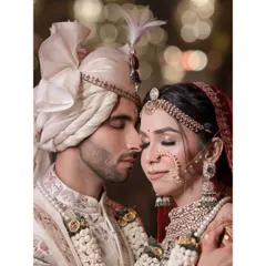 An intimate close-up of the bride and groom during their wedding ceremony, with beautiful bokeh in the background.
