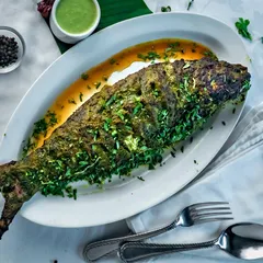 We prepare our Rawas, also known as Indian Salmon, with an aromatic twist. The delicate fish is coated in a mint and garlic marinade and cooked to bring out its rich flavor.