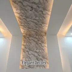Here, I've used a single, continuous UV marble sheet that flows from the wall up to the ceiling, creating a dramatic and seamless effect. The side cove lighting highlights the beautiful marble texture, making the entire space feel taller and more luxurious.
