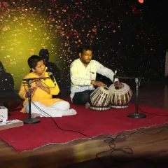 A beautiful moment of 'jugalbandi' between a young flutist and his guru on the tabla. This image embodies our commitment to the Guru-Shishya tradition, where classical training is passed on with personal attention and care.