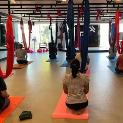 Participants settling into a guided relaxation practice at the studio. My on-site sessions provide a dedicated space for teams to build camaraderie and focus on their collective well being away from their desks.