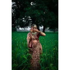 For me, bridal portraits are about capturing quiet, real moments. Here, the bride is in a beautiful green field in Mirzapur, with the rich colours of her lehenga standing out against the natural backdrop.