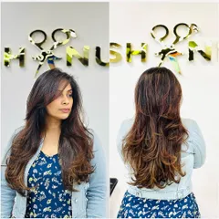 A perfect example of a layered haircut and professional hair set. The layers create volume and movement, while the styling gives it a polished, glamorous finish.