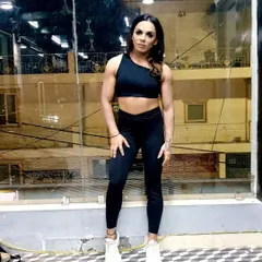A relaxed pose at the gym. Not every photo is a flex. It's also about feeling confident and strong in your body every day, which is a core goal of my nutrition coaching.