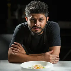 A moment of focus as I prepare one of my newest creations. Every dish I design is a personal expression, blending traditional techniques with innovative flavors.