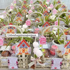 An overview of a large order of housewarming return gift baskets, all uniformly and beautifully assembled for the special occasion.