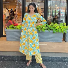 Brighten your day with this sunny yellow floral print kurta set. The A-line kurta is so versatile you can even wear it as a standalone dress, and the chevron-print pants add a modern touch.