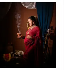 For those who want to honor their heritage, I offer shoots inspired by the timeless art of Raja Varma. The dramatic lighting, rich colors of the saree, and traditional props like this dhuni create a portrait that feels like a classical painting, full of grace and cultural significance.