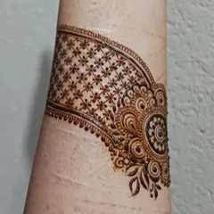 A practice doodle of a cuff design. I often practice creating bands and bracelets with different textures, like this one with a delicate grid and floral motif.