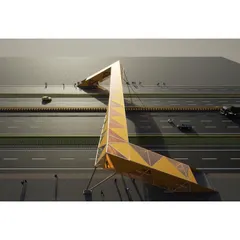 An aerial view showing how the footbridge spans a major highway. The design provides a safe and accessible pedestrian connection while creating a distinct visual marker in the urban landscape.