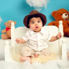Look at that surprised expression. I love capturing the full range of emotions your baby shows as they explore the world around them.