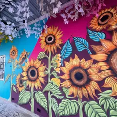 A beautiful wall of sunflowers I painted. The bright yellow and bold design create an irresistible backdrop that brings warmth and joy to the space.