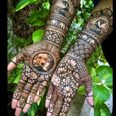 A full view of the engagement mehndi I created in memory of a beloved pet. The design features a portrait of the bride and her dog, surrounded by intricate floral work and traditional peacock and elephant motifs.