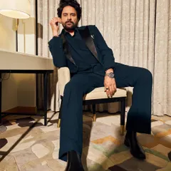 A relaxed yet powerful moment with Jaideep Ahlawat at IIFA. This dark teal suit with a satin lapel is a sophisticated choice for a formal event.