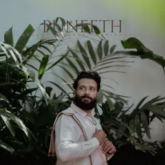 A stylish portrait of a groom-to-be on his betrothal day, dressed in a traditional South Indian panche.