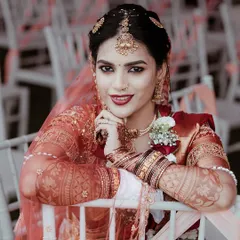 A quiet moment for the bride. I love taking these classic bridal portraits, focusing on the intricate details of the attire, the professional makeup, and that look of happy anticipation.