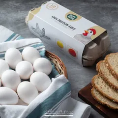 This shot for a carton of high-protein eggs uses a clean, natural style. Including the bread and a simple basket creates a breakfast context, helping customers visualize the product in their daily lives.
