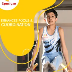 Gymnastics enhances focus and coordination. This young athlete shows intense concentration while performing on the parallel bars, a key piece of equipment for developing upper body strength.