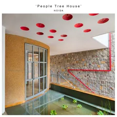 This shallow water body, fed by harvested rainwater, is inspired by countryside ponds. It provides a place for parched birds and insects to find water and shelter among the rocks and aquatic plants, right at the entrance of the home.