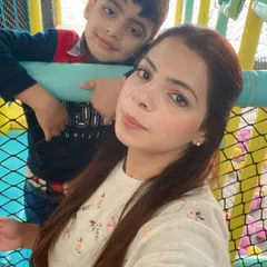 A mother and son take a quick break from playing. The safety netting and open design mean you're never far from the fun.