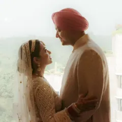 A beautiful silhouette of Keerat and Pratyush against a window during their Anand Karaj ceremony. This intimate portrait captures their connection as they begin their life together.