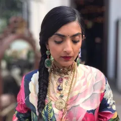 A beautifully executed fishtail braid. This hairstyle is a great alternative to a traditional braid, offering a more intricate and bohemian look that is perfect for a mehendi or a casual wedding event.