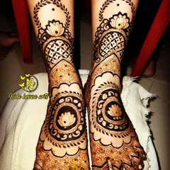 A lovely lotus themed design for bridal feet. The central mandala with a lotus is a classic choice, and the pattern extends up the ankle with delicate leafy vines.