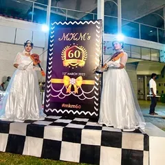 To create an atmosphere of elegance for a 60th birthday party, I had two violinists in beautiful white gowns play as guests arrived. It adds a touch of class to any entrance.