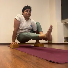 Eka Hasta Bhujasana (Elephant's Trunk Pose) is a journey. This student is using blocks to build the strength and muscle memory required for this arm balance. We celebrate every stage of the process, knowing that consistency is the key.
