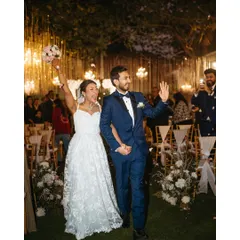 The pure, unfiltered joy of walking out hand-in-hand as husband and wife. We live for these moments of celebration, capturing the energy as you step into your forever, showered with love and flower petals.