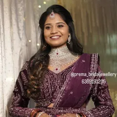 Another beautiful shot of the bride, showing how the jewellery catches the light. The soft, wavy hairstyle completes this modern and elegant reception look.