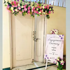 We also provide entrance decor for your events, like this beautiful floral arrangement and personalized welcome sign for an engagement ceremony.
