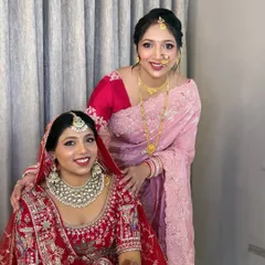 A precious moment between the bride and her sister. I had the pleasure of doing the makeup for both of these lovely ladies.