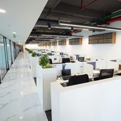 A look at the expansive open-plan workspace in our new Delhi office. The design promotes collaboration and efficiency, reflecting our commitment to a dynamic work environment for our team.