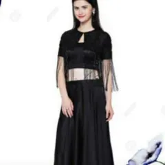 This trendy black three-piece set includes a crop top, a flowing skirt, and a matching jacket with fringe details on the sleeves. It's a fun and glamorous outfit perfect for a sangeet or cocktail night.