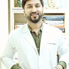 A candid shot of me in my doctor's coat at the clinic. My mission is simple: to help make the world a little healthier and more beautiful, one client at a time.