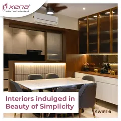 A great kitchen design considers the adjoining spaces. Here, the dining area is designed to complement the kitchen, with warm wood tones and soft lighting creating a cohesive and inviting atmosphere for family meals.