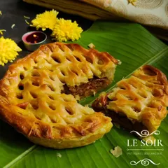 This is my Egg Roast Puff Pie, featuring a spicy and flavorful egg roast masala filling inside a flaky, golden-brown puff pastry that I make from scratch. This shows my take on savory Indian flavors.