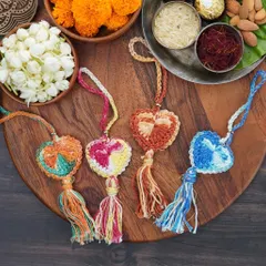 A beautiful flat-lay of my heart-shaped crochet lumbas in four different color combinations. These come with matching tassels and are perfect for your sister or sister-in-law.