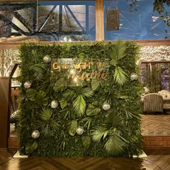 'One night in Miami' for a stag party. We created this tropical jungle-themed photo wall with lush greenery, palm leaves, and disco balls for a fun and stylish celebration.